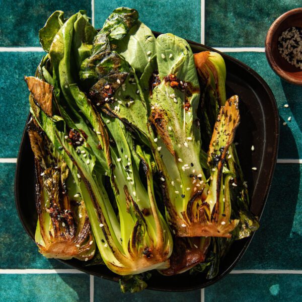 Pan Seared Bok Choy on a black plate