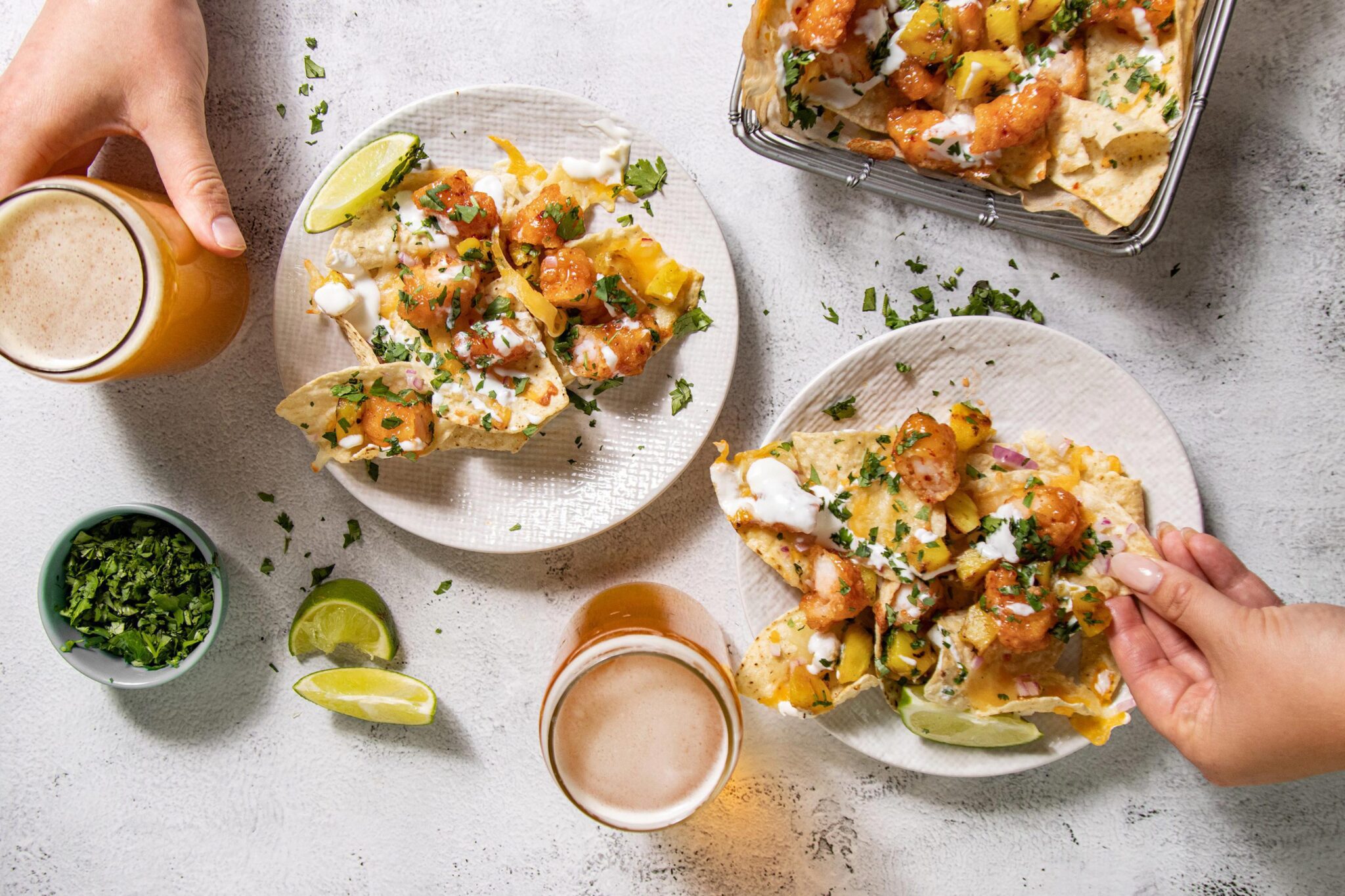 two plates of shrimp nachos