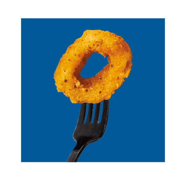 Social Kitchens Breaded Calamari Ring on a black fork with a dark blue colored background