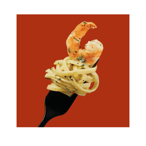 Social Kitchens Steakhouse Shrimp Linguine on a black fork over an orange-red colored background.